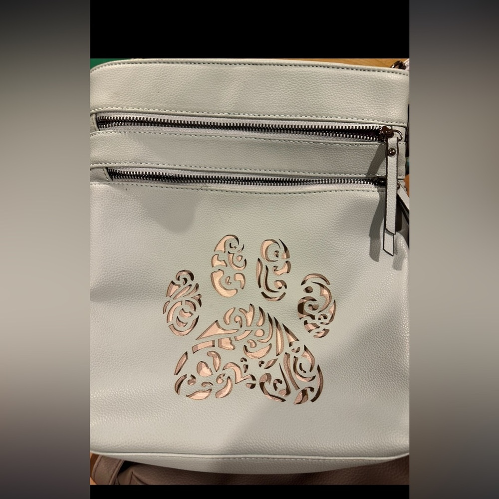 1st picture Blue crossbody with paw print, 2nd picture black kids lock armpits
